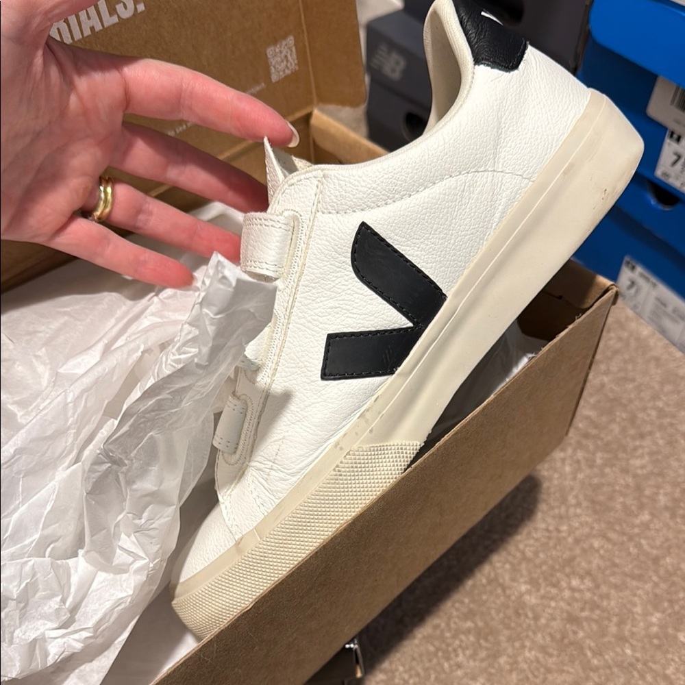 White Sneakers with Black Logo